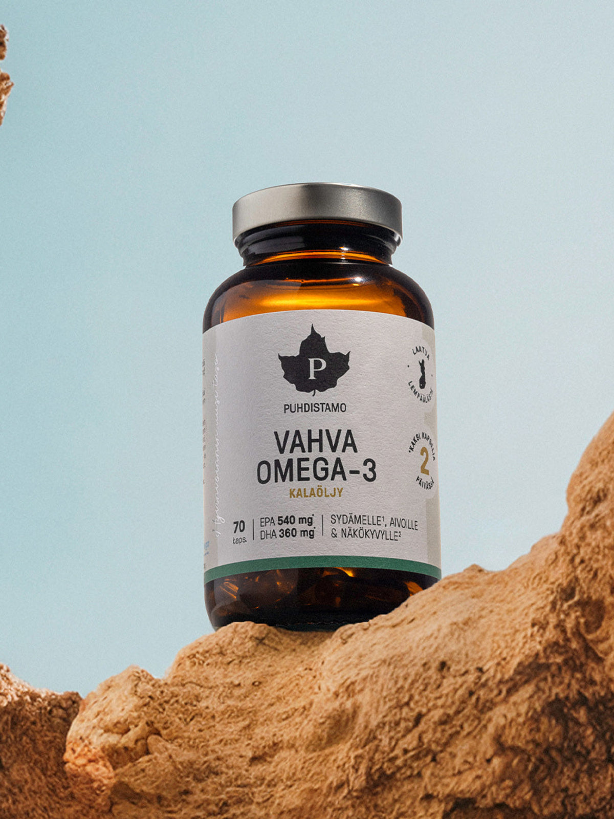 Puhdistamon Vahva Omega-3 kalaöljykapselipurkki kallion päällä