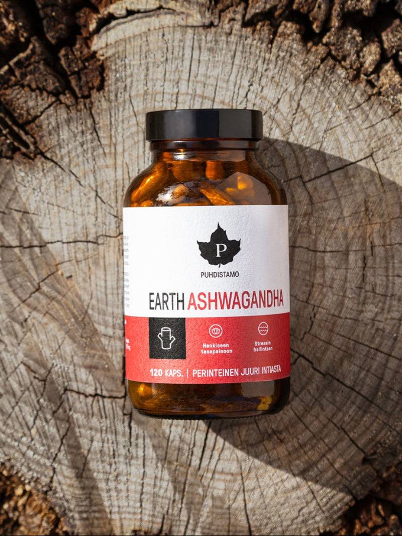 Puhdistamo Earth Ashwagandha purkki puun rungon päälle